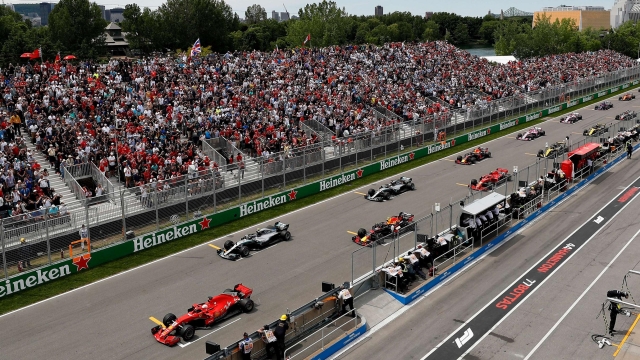 MONTREAL, QC - JUNE 10: Sebastian Vettel of Germany driving the (5) Scuderia Ferrari SF71H leads the field off the start line during the Canadian Formula One Grand Prix at Circuit Gilles Villeneuve on June 10, 2018 in Montreal, Canada.   Getty Images/Getty Images/AFP
== FOR NEWSPAPERS, INTERNET, TELCOS & TELEVISION USE ONLY ==