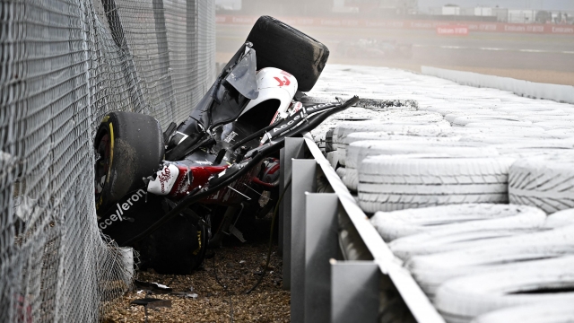 Alfa Romeo Chinese driver Zhou Guanyu is seen in the crash barriers during an incident at the star during the Formula One British Grand Prix at the Silverstone motor racing circuit in Silverstone, central England on July 3, 2022. (Photo by Ben Stansall / AFP)
