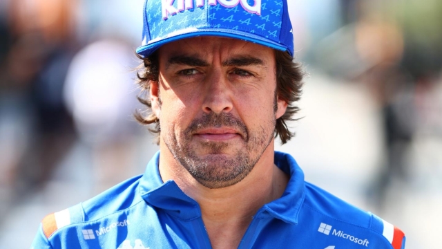 BUDAPEST, HUNGARY - JULY 28: Fernando Alonso of Spain and Alpine F1 walks in the Paddock during previews ahead of the F1 Grand Prix of Hungary at Hungaroring on July 28, 2022 in Budapest, Hungary. (Photo by Mark Thompson/Getty Images)