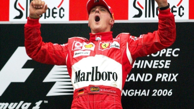 German Formula One driver Michael Schumacher of Scuderia Ferrari celebrating on the podium after winning the Grand Prix of China in Shanghai, China, 01 October 2006. ANSA/GERO BRELOER
