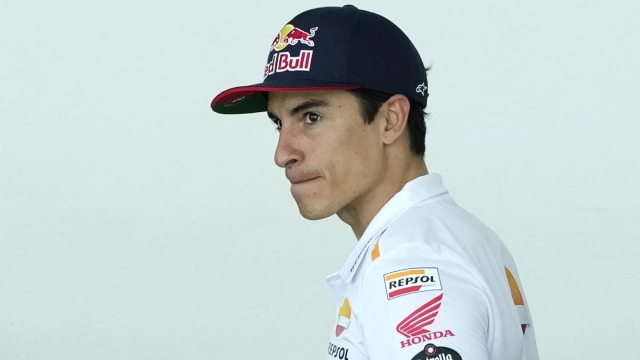 MotoGP rider Marc Marquez of Spain walks in the paddock after getting injured in a crash during the Portugal Motorcycle Grand Prix, at the Algarve International circuit near Portimao, Portugal, Sunday, March 26, 2023. (AP Photo/Jose Breton)