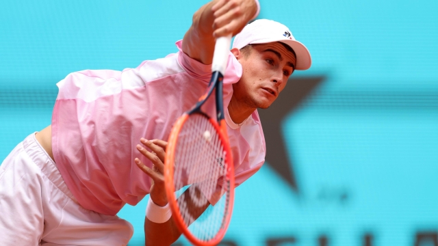 MADRID, SPAIN - APRIL 28: Matteo Arnaldi of Italy serves against Casper Ruud of Norway during the Men's Singles second round match on Day Five of the Mutua Madrid Open at La Caja Magica on April 28, 2023 in Madrid, Spain. (Photo by Clive Brunskill/Getty Images)
