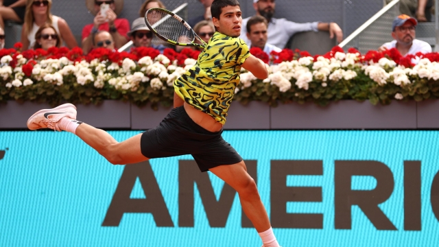 MADRID, SPAIN - MAY 02: Carlos Alcaraz of Spain plays a forehand against Alexander Zverev of Germany during the Fourth Round match on Day Nine of the Mutua Madrid Open at La Caja Magica on May 02, 2023 in Madrid, Spain. (Photo by Clive Brunskill/Getty Images)