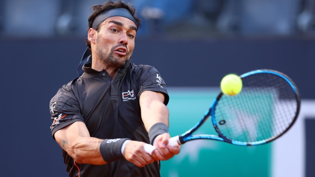 ROME, ITALY - MAY 10: Fabio Fognini of Italy plays a backhand against Andy Murray of Great Britain during the Men's Singles First Round match on Day Three of the Internazionali BNL D'Italia 2023 at Foro Italico on May 10, 2023 in Rome, Italy. (Photo by Alex Pantling/Getty Images)