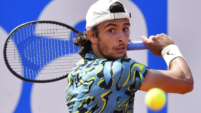 Italy's Lorenzo Musetti returns the ball to Greece's Stefanos Tsitsipas during the ATP Barcelona Open "Conde de Godo" tennis tournament singles semi-final match at the Real Club de Tenis in Barcelona on April 22, 2023. (Photo by Pau BARRENA / AFP)