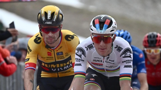 (L-R) Slovenian rider  Primoz Roglic of team Jumbo Visma and belgian rider Remco Evenepoel of Soudal Quick-Step team in action to cross the finish line and win the seventh stage of the 2023 Giro d'Italia cycling race over 218 km from Capua to Gran Sasso d'Italia, Italy, 12 May 2023. ANSA/LUCA ZENNARO