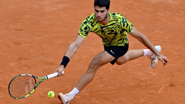 Carlos Alcaraz of Spain in action during his men's singles third round match against Fabian Marozsan of Hungary (not pictured) at the Italian Open tennis tournament in Rome, Italy, 15 May 2023.  ANSA/ETTORE FERRARI