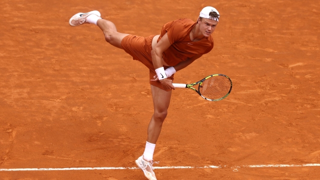 ROME, ITALY - MAY 17: Holger Rune of Denmark serves against Novak Djokovic of Serbia during their Men's Singles quarter-final match on day ten of Internazionali BNL D'Italia 2023 at Foro Italico on May 17, 2023 in Rome, Italy. (Photo by Alex Pantling/Getty Images)