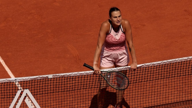 PARIS, FRANCE - JUNE 06: Aryna Sabalenka waits at the net before Elina Svitolina of Ukraine (not pictured) refuses to shake hands after the Women's Singles Quarter Final match on Day Ten of the 2023 French Open at Roland Garros on June 06, 2023 in Paris, France. (Photo by Julian Finney/Getty Images)