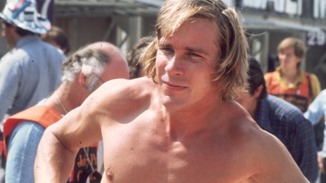18th July 1976:  Formula 1 racing driver James Hunt  (1947 - 1993) with his overalls pushed down to his waist at the Brands Hatch British Grand Prix.  (Photo by Keystone/Getty Images)