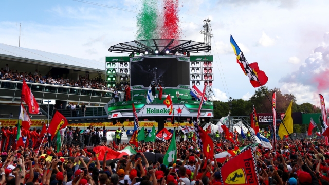 MONZA, ITALY - SEPTEMBER 08: A general view as race winner Charles Leclerc of Monaco and Ferrari celebrates on the podium with second placed Valtteri Bottas of Finland and Mercedes GP and third place Lewis Hamilton of Great Britain and Mercedes GP during the F1 Grand Prix of Italy at Autodromo di Monza on September 08, 2019 in Monza, Italy. (Photo by Dan Istitene/Getty Images)