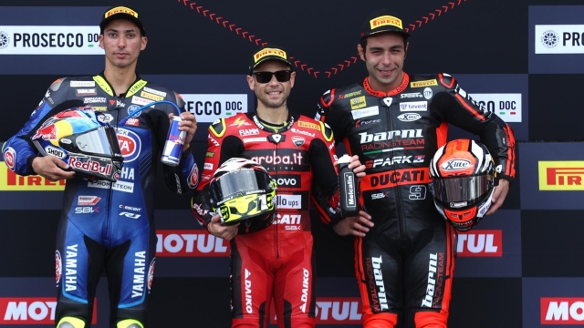 DONNINGTON, ENGLAND - JULY 02: (L-R) 2nd placed Toprak Razgatlioglu of Turkey, 1st placed Alvaro Bautista of Spain and 3rd placed Danilo Petrucci of Italy stand on the podium folliwing The WorldSBK Race 2 in the 2023 MOTUL FIM Superbike World Championships at Donnington Park on July 02, 2023 in Donnington, England. (Photo by Alex Pantling/Getty Images)