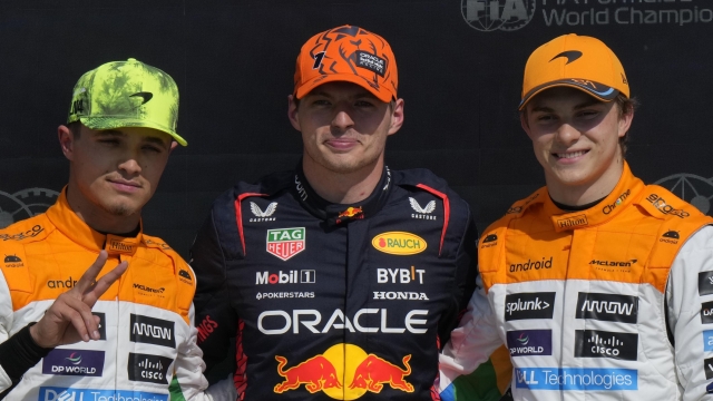 From left: McLaren driver Lando Norris of Britain, Red Bull driver Max Verstappen of the Netherlands and McLaren driver Oscar Piastri of Australia pose after the qualifying session at the British Formula One Grand Prix at the Silverstone racetrack, Silverstone, England, Saturday, July 8, 2023. The British Formula One Grand Prix will be held on Sunday. (AP Photo/Luca Bruno)