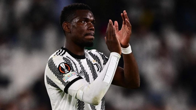 TOPSHOT - Juventus' French midfielder Paul Pogba acknowledges the public at the end of the UEFA Europa League semi-final first leg football match between Juventus and Sevilla on May 11, 2023 at the Juventus stadium in Turin. (Photo by Marco BERTORELLO / AFP)