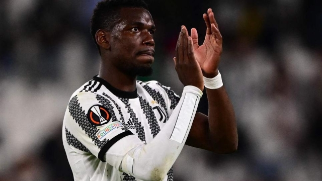TOPSHOT - Juventus' French midfielder Paul Pogba acknowledges the public at the end of the UEFA Europa League semi-final first leg football match between Juventus and Sevilla on May 11, 2023 at the Juventus stadium in Turin. (Photo by Marco BERTORELLO / AFP)
