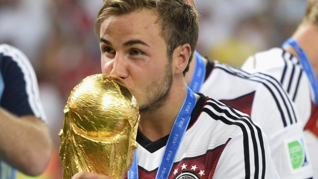 RIO DE JANEIRO, Brazil - Germany's Mario Gotze kisses the World Cup trophy after Germany beat Argentina 1-0 to win their fourth World Cup title at the Maracana Stadium in Rio de Janeiro, Brazil, on July 13, 2014. Gotze scored the winning goal in the second half of extra-time of the final. (Kyodo)
