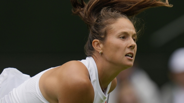 Russia's Daria Kasatkina serves to Britain's Jodie Burrage during the women's singles match on day three of the Wimbledon tennis championships in London, Wednesday, July 5, 2023. (AP Photo/Alastair Grant)