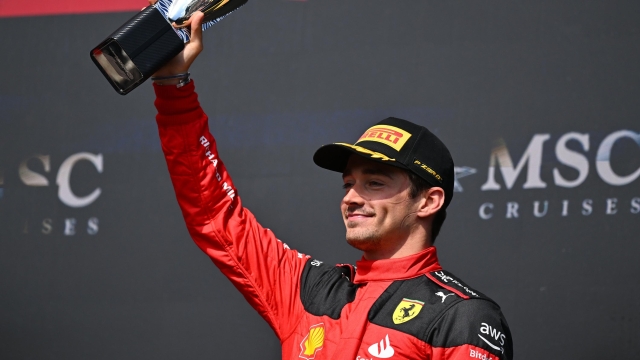 SPA, BELGIUM - JULY 30: Third placed Charles Leclerc of Monaco and Ferrari celebrates on the podium during the F1 Grand Prix of Belgium at Circuit de Spa-Francorchamps on July 30, 2023 in Spa, Belgium. (Photo by Dan Mullan/Getty Images)
