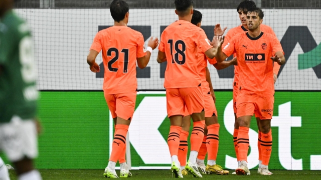 epa10768290 Valencia's Alberto Mari, right, and team celebrate the 2-1 lead during the friendly soccer match between FC St. Gallen and Valencia CF at the Kybunpark stadium in St. Gallen, Switzerland, 25 July 2023.  EPA/GIAN EHRENZELLER