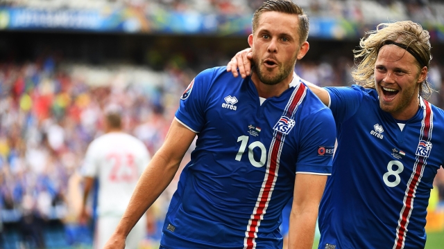 Iceland's midfielder Gylfi Sigurdsson (2nd R) celebrates after scoring his team's first goal during the Euro 2016 group F football match between Iceland and Hungary at the Stade Velodrome in Marseille on June 18, 2016. / AFP / ANNE-CHRISTINE POUJOULAT        (Photo credit should read ANNE-CHRISTINE POUJOULAT/AFP via Getty Images)