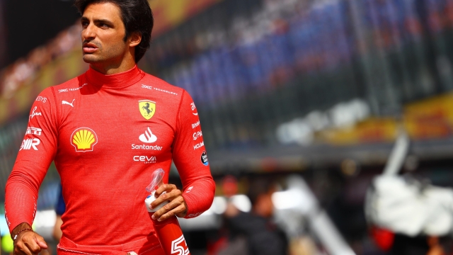 ZANDVOORT, NETHERLANDS - AUGUST 27: Carlos Sainz of Spain and Ferrari prepares to drive on the grid prior to the F1 Grand Prix of The Netherlands at Circuit Zandvoort on August 27, 2023 in Zandvoort, Netherlands. (Photo by Mark Thompson/Getty Images)