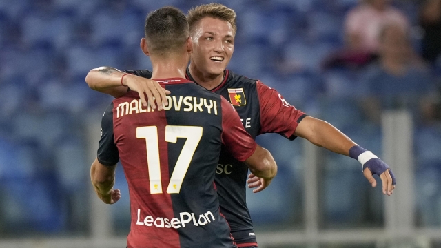 Genoa?s Mateo Retegui, right, celebrates with his teammate Matteo Malkowski after he scored his side?s first goal during a Serie A soccer match between Lazio and Genoa, at Rome's Olympic Stadium, Sunday, Aug. 27, 2023. (AP Photo/Andrew Medichini)