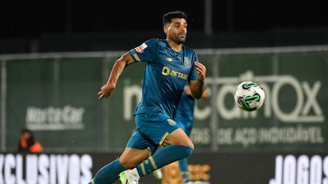 FC Porto's Iranian forward #09 Mehdi Taremi runs for the ball during the Portuguese league football match between Rio Ave FC and FC Porto at the Rio Ave FC - Dos Arcos stadium in Vila do Conde on August 28, 2023. (Photo by MIGUEL RIOPA / AFP)