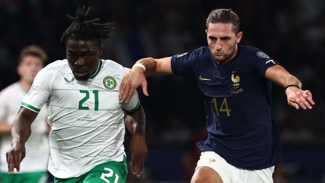 Republic of Ireland's forward #21 Festy Ebosele fights for the ball with France's midfielder #14 Adrien Rabiot during the UEFA Euro 2024 football tournament Group B qualifying match between France and Republic of Ireland, at the Parc des Princes stadium in Paris, on September 7, 2023. (Photo by Anne-Christine POUJOULAT / AFP)