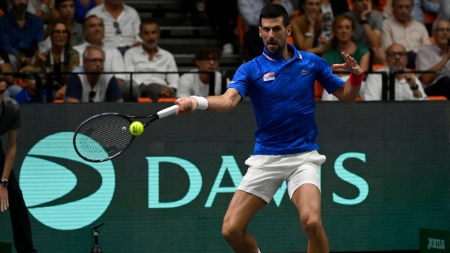 Serbia's Novak Djokovic returns a ball to Spain's Alejandro Davidovich Fokina during the group stage men's singles match between Spain and Serbia of the Davis Cup tennis tournament at the Fuente San Luis Sports Hall in Valencia on September 15, 2023. (Photo by JOSE JORDAN / AFP)