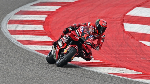 Ducati Lenovo Team's Italian rider Francesco Bagnaia steers his bike during the qualifying session ahead of the Indian MotoGP Grand Prix at the Buddh International Circuit in Greater Noida on the outskirts of New Delhi, on September 23, 2023. (Photo by Money SHARMA / AFP)