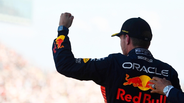 SUZUKA, JAPAN - SEPTEMBER 24: Race winner Max Verstappen of the Netherlands and Oracle Red Bull Racing celebrates on the podium during the F1 Grand Prix of Japan at Suzuka International Racing Course on September 24, 2023 in Suzuka, Japan. (Photo by Rudy Carezzevoli/Getty Images)