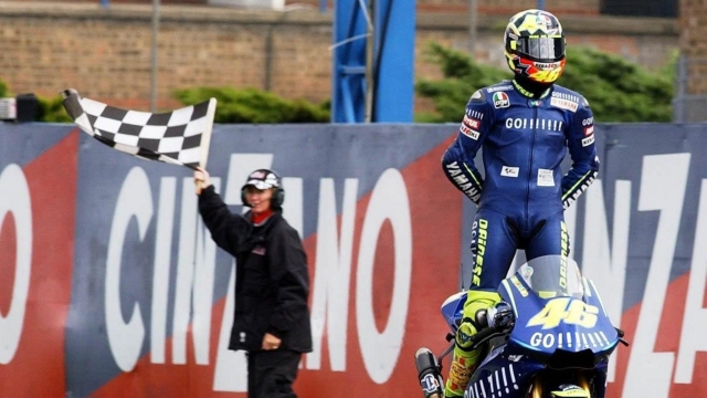 epa000239217 Italy's Valentino Rossi celebrates crossing the line in first place to win the Moto GP British Grand Prix at Donington Park, Sunday 25 July  2004. Former world superbike champion Colin Edwards was second for his first podium finish since his switch to MotoGP at the start of 2003. 
Edwards' team-mate Sete Gibernau was third ahead of Nicky Hayden, with Troy Bayliss fifth. 
Rossi now has 164 points in the title race, while Gibernau and Max Biaggi, who finished a disappointing 12th, share second on 142 points.  EPA/RUI VIEIRA