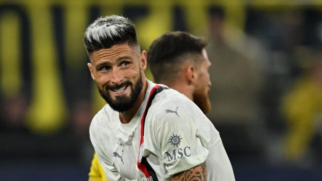 AC Milan's French forward #09 Olivier Giroud reacts during the UEFA Champions League Group F football match between Borussia Dortmund and AC Milan in Dortmund, western Germany on October 4, 2023. (Photo by INA FASSBENDER / AFP)