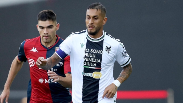 Udinese's Roberto Pereyra (R) and Genoa's Johan Vasquez in action during the Italian Serie A soccer match Udinese Calcio vs Genoa CFC at the Friuli - Dacia Arena stadium in Udine, Italy, 1 October 2023. ANSA / GABRIELE MENIS