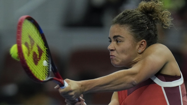 Jasmine Paolini of Italy returns a shot to Aryna Sabalenka of Belarus during the 3rd round of the women's singles match in the China Open tennis tournament at the Diamond Court in Beijing, Thursday, Oct. 5, 2023. (AP Photo/Andy Wong)
