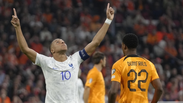 France's Kylian Mbappe celebrates after scoring his side's opening goal during the Euro 2024 group B qualifying soccer match between The Netherlands and France at the Johan Cruyff ArenA stadium in Amsterdam, Netherlands, Friday, Oct. 13, 2023. (AP Photo/Peter Dejong)