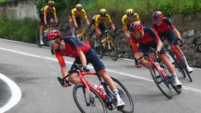 INEOS Grenadiers's British rider Geraint Thomas (Front) and riders of the pack cycle down the Valico di Valcava pass during the fifteenth stage of the Giro d'Italia 2023 cycling race, 195 km between Seregno and Bergamo, on May 21, 2023. (Photo by Luca Bettini / AFP)