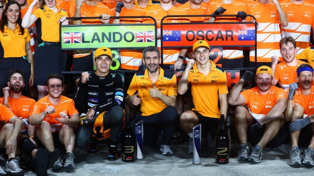 LUSAIL CITY, QATAR - OCTOBER 08: Second placed Oscar Piastri of Australia and McLaren and Third placed Lando Norris of Great Britain and McLaren celebrate with their team after the F1 Grand Prix of Qatar at Lusail International Circuit on October 08, 2023 in Lusail City, Qatar. (Photo by Clive Rose/Getty Images)