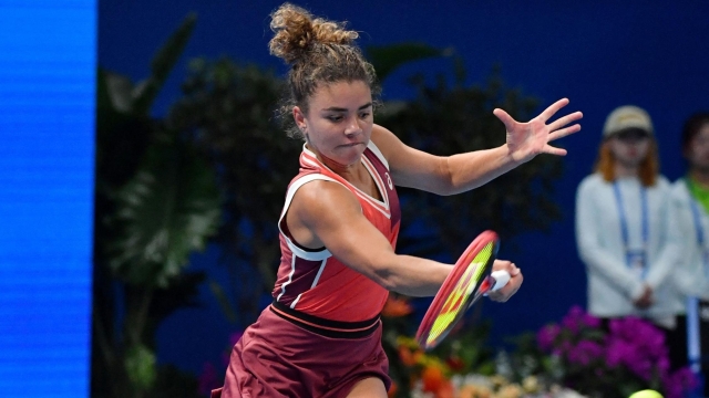 Italy's Jasmine Paolini hits a return to China's Zheng Qinwen during their women's singles semi-final match of the WTA Zhengzhou Open tennis tournament in Zhengzhou, in China's central Henan province on October 14, 2023. (Photo by AFP) / China OUT