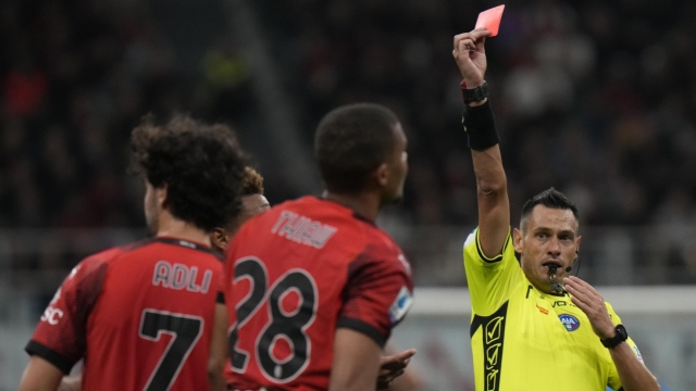 AC Milan's Malick Thiaw, centre, is shown red card during a Serie A soccer match between AC Milan and Juventus, at the San Siro stadium in Milan, Italy, Sunday, Oct. 22, 2023. (AP Photo/Luca Bruno)