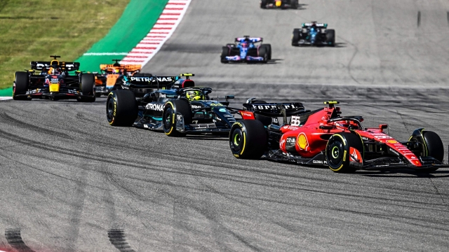 Ferrari's Spanish driver Carlos Sainz Jr followed by Mercedes' British driver Lewis Hamilton and Red Bull Racing's Dutch driver Max Verstappen start the 2023 United States Formula One Grand Prix at the Circuit of the Americas in Austin, Texas, on October 22, 2023. (Photo by CHANDAN KHANNA / AFP)