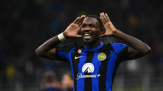 TOPSHOT - Inter Milan's French forward #09 Marcus Thuram after scoring the team's first goal during the Italian Serie A football match between Inter Milan and AS Roma at San Siro Stadium, in Milan on October 29, 2023. (Photo by Isabella BONOTTO / AFP)