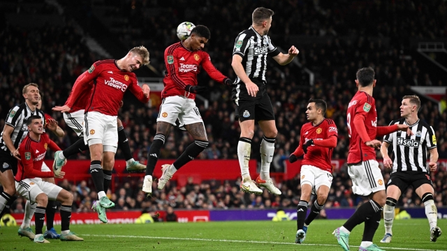 Manchester United's English striker #10 Marcus Rashford (C) heads the ball as he defends the goal from a corner shot during the English League Cup fourth round football match between Manchester United and Newcastle United at Old Trafford, in Manchester, north west England, on November 1, 2023. (Photo by Paul ELLIS / AFP) / RESTRICTED TO EDITORIAL USE. No use with unauthorized audio, video, data, fixture lists, club/league logos or 'live' services. Online in-match use limited to 120 images. An additional 40 images may be used in extra time. No video emulation. Social media in-match use limited to 120 images. An additional 40 images may be used in extra time. No use in betting publications, games or single club/league/player publications. /