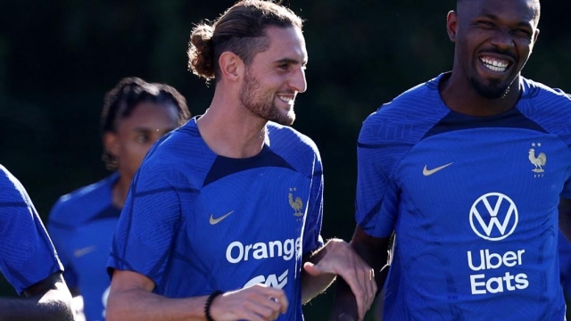(From L) France's midfielder Adrien Rabiot (C) jokes with France's forward Marcus Thuram (R) during a training session in Clairefontaine-en-Yvelines on September 4, 2023 as part of the team's preparation for the upcoming UEFA Euro 2024 football tournament qualifying matches. France will play against Ireland on September 7, 2023, in the Group B of Euro 2024 qualifiers. (Photo by FRANCK FIFE / AFP)