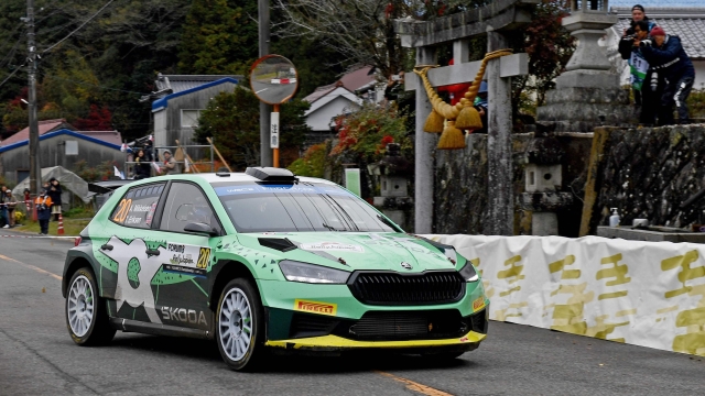 Andreas Mikkelsen and his co-driver Torstein Eriksen of Norway drive their Skoda Fabia RS in Rally2 class past the Kumano shrine during SS10 Lake Mikawako section of the Rally Japan, the 13th round of the FIA World Rally Championships, in Toyota city on November 18, 2023. (Photo by Toshifumi KITAMURA / AFP)