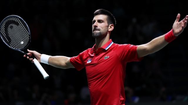 MALAGA, SPAIN - NOVEMBER 23: Novak Djokovic of Serbia celebrates winning match point during the Quarter-Final match against Cameron Norrie of Great Britain in the Davis Cup Final at Palacio de Deportes Jose Maria Martin Carpena on November 23, 2023 in Malaga, Spain. (Photo by Clive Brunskill/Getty Images for ITF)