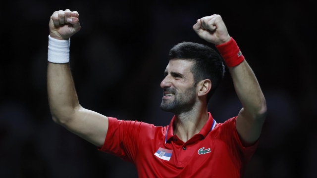 epa10991654 Novak Djokovic of Serbia celebrates his victory over Cameron Norrie of Great Britain in their singles match of the Davis Cup quarter final tie between Serbia and Great Britain in Malaga, Spain, 23 November 2023.  EPA/Jorge Zapata
