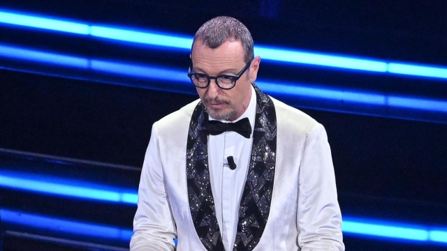 Sanremo Festival host and artistic director Amadeus reads a message by Ukrainian President Volodymyr Zelensky on stage at the Ariston theatre during the 73rd Sanremo Italian Song Festival, in Sanremo, Italy, 11 February 2023. The music festival will run from 07 to 11 February 2023.  ANSA/ETTORE FERRARI