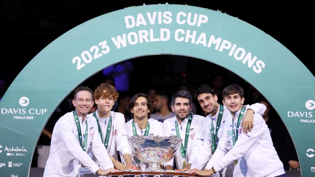 MALAGA, SPAIN - NOVEMBER 26: Filippo Volandri, Jannik Sinner, Lorenzo Musetti, Matteo Arnaldi, Lorenzo Sonego and Simone Bolelli of Italy celebrate with the Davis Cup Trophy after their teams victory during the Davis Cup Final match against Australia at Palacio de Deportes Jose Maria Martin Carpena on November 26, 2023 in Malaga, Spain. (Photo by Clive Brunskill/Getty Images for ITF)