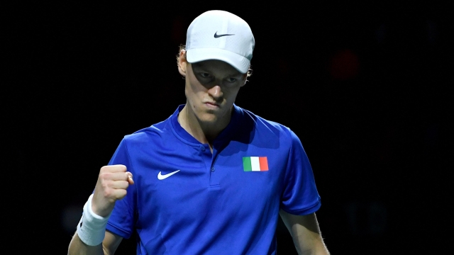 Italy's Jannik Sinner reacts as he plays against Netherlands' Tallon Griekspoor during the fourth men's single quarter-final tennis match between Italy and Netherlands of the Davis Cup tennis tournament at the Martin Carpena sportshall, in Malaga on November 23, 2023. (Photo by JORGE GUERRERO / AFP)